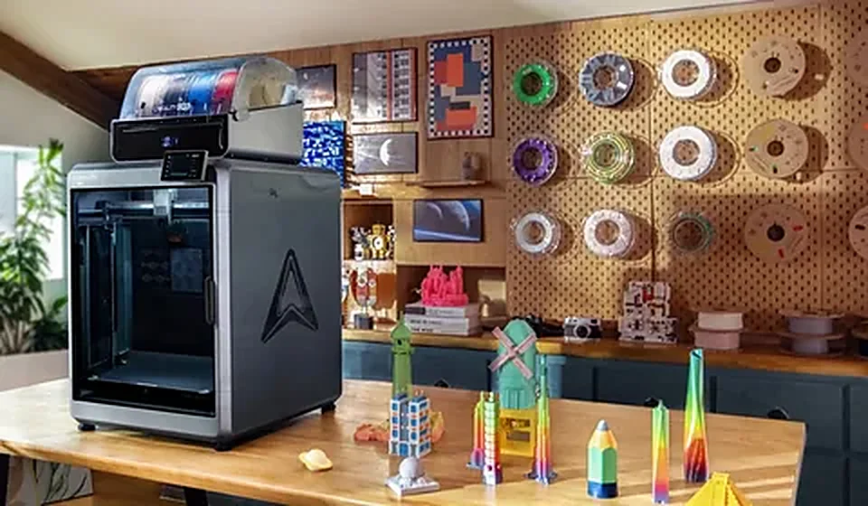 Workshop wall of filament spools and printed parts